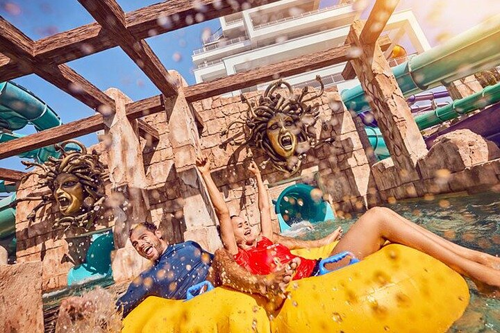 Daring water slides and playful splashes await at Atlantis Aquaventure where friends create unforgettable memories amid a fun-filled aquatic paradise at Dubai's iconic resort.